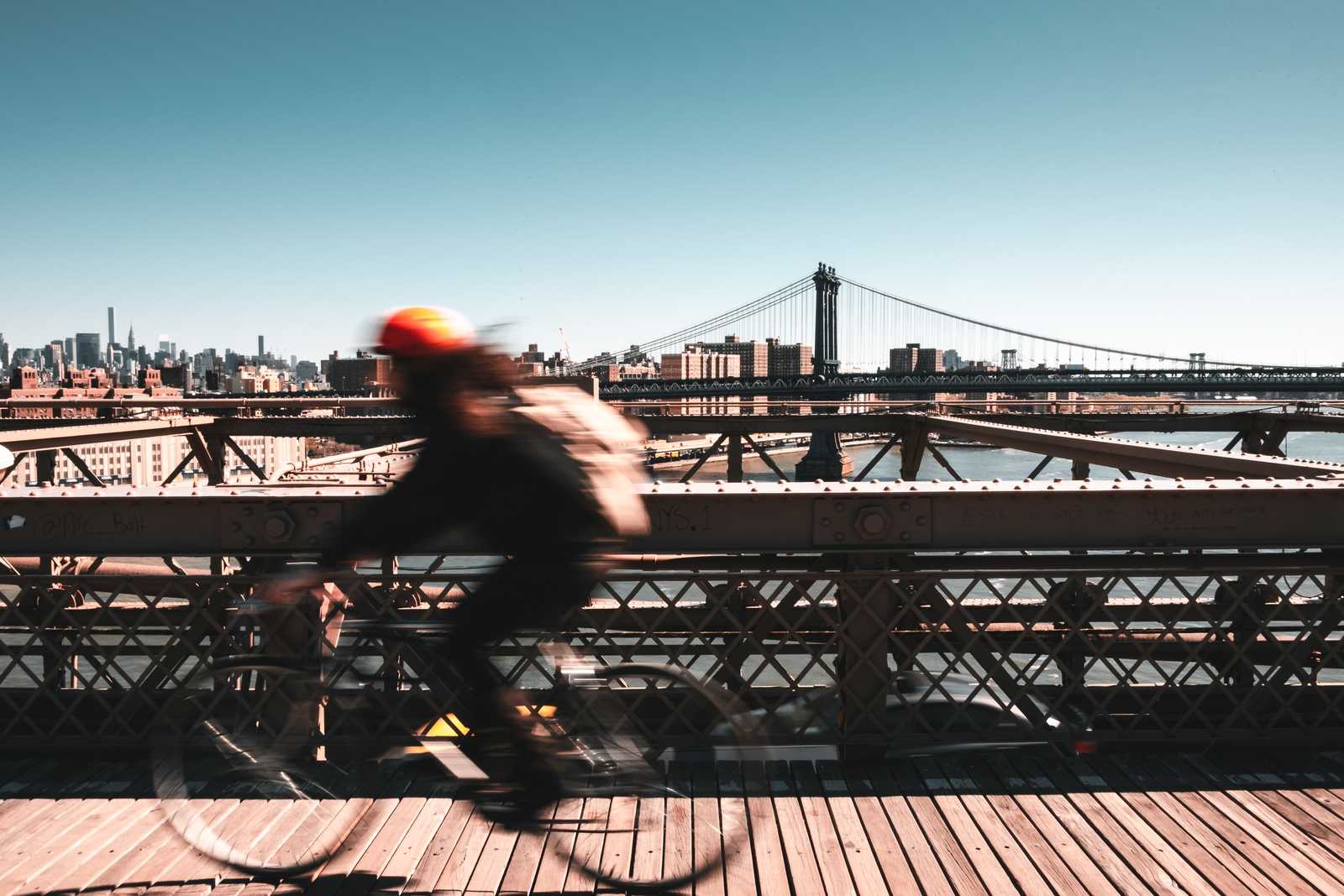 Cyclist on Brooklyn Bridge going to work